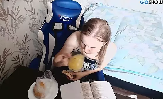 Naughty student pleasures her tits while studying